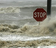 Water-covered road in Bay St. Louis, Mississippi, with stop sign visible during 2008's Hurricane Gustav.